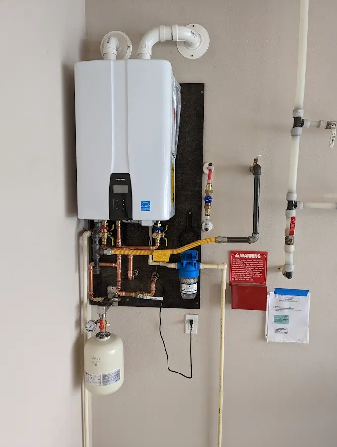 Professional plumber installing copper piping in a Mabank home